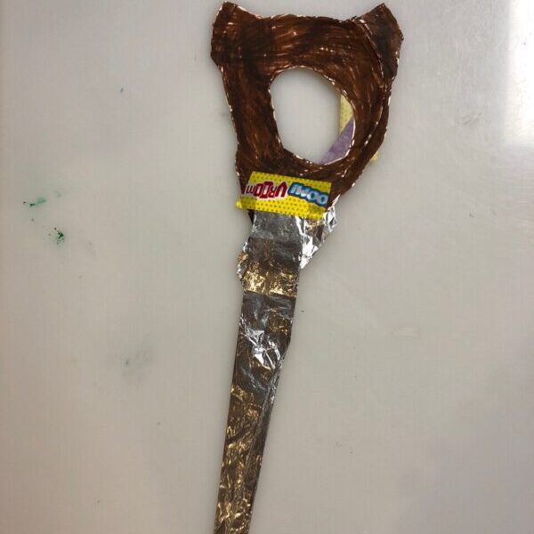 Wand made out of a paper plate and foil.